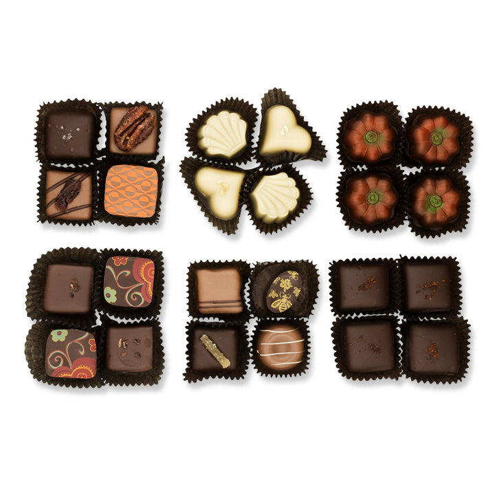 Six sets of assorted, patterned, and plain chocolates arranged in black wrappers make the Autumn Chocolate Sampler Gift Box by Ragged Coast Chocolates a filled-chocolate fan's dream. Each set contains four exquisite pieces that promise to delight your taste buds.