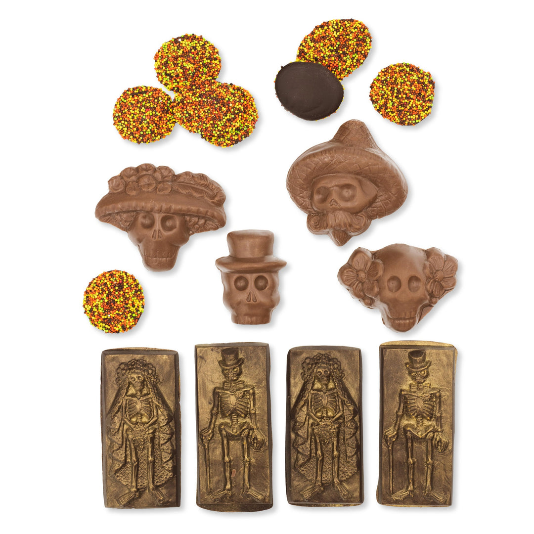 The Halloween Chocolate Party Bundle from Ragged Coast Chocolates includes an assortment of Día de los Muertos-themed chocolates, with dark chocolate skulls and skeleton shapes, as well as sprinkled chocolate discs that evoke Halloween nonpareils.