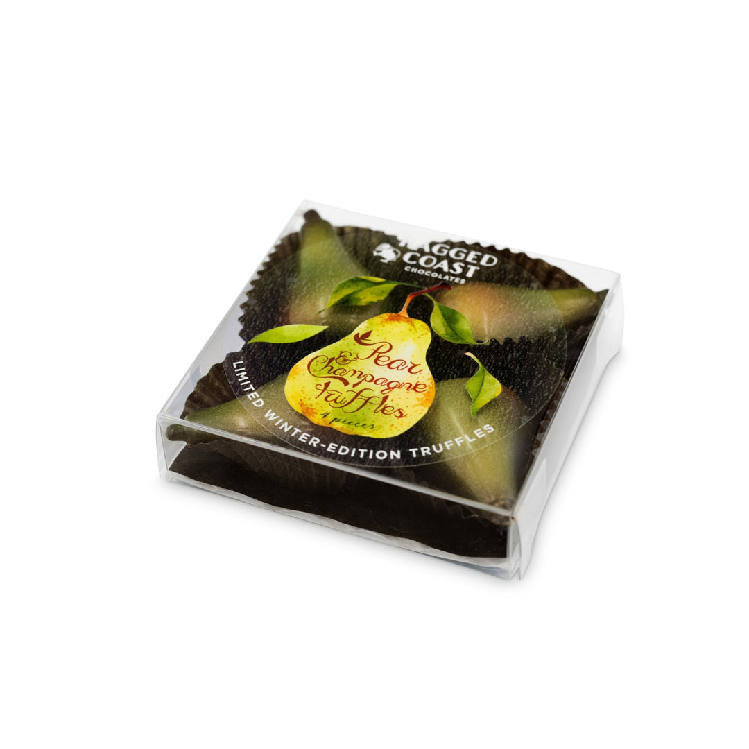 A festive box containing two Pear Champagne Truffles from Ragged Coast Chocolates, presented in a clear plastic container adorned with an illustrated pear label. These treats are crafted with locally-grown pears and enveloped in luscious milk chocolate.