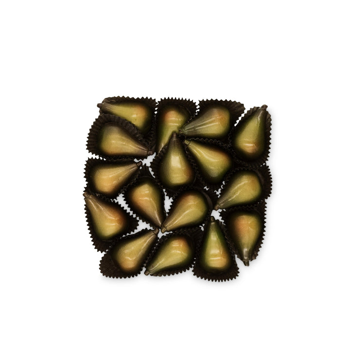 A square arrangement of Ragged Coast Chocolates' Pear Champagne Truffles for the Holidays, featuring small, green, pear-shaped chocolates made from locally-grown pears and bittersweet chocolate, nestled in dark wrappers against a plain white background.