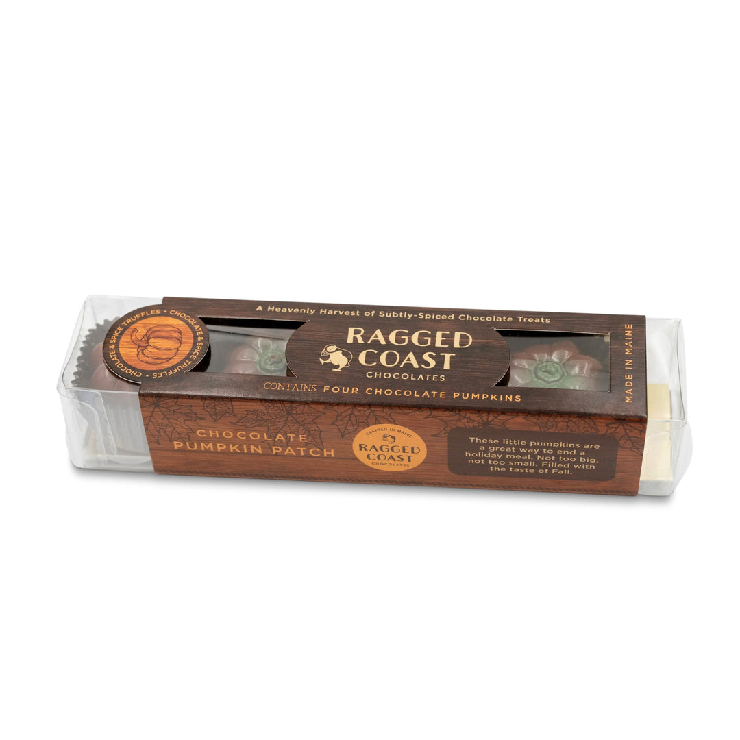 A clear box containing "Ragged Coast Chocolates" labeled "Pumpkin Patch Chocolate Truffles" with four pumpkin-shaped bonbons inside. The box includes a logo and the phrase "made in Maine" at the bottom. This seasonal treat is perfect for chocolate lovers.