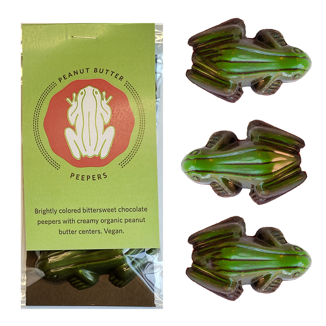 Enhance your Saint Patrick's Day with Ragged Coast Chocolates' Saint Patrick's Day Gift Box, featuring three vegan-friendly, bittersweet frog-shaped chocolates filled with organic peanut butter.